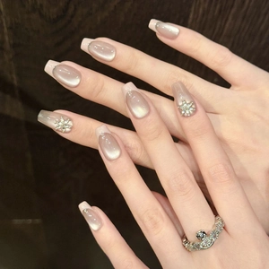 Pink cat eye press-on nails with 3D diamond flower decorations in medium square shape