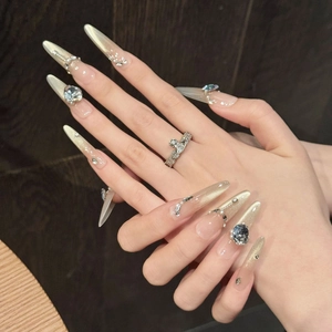 Champagne gold cat-eye stiletto press-on nails with luxury rhinestones and pearls