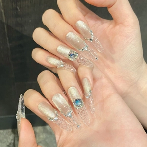 Silver cat-eye press-on nails with 3D lace relief and sparkling rhinestone crystals
