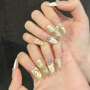 French bow press-on nails with golden cat eye effect and white resin 3D butterfly design