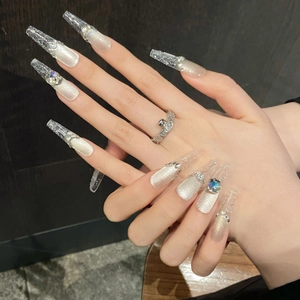 Silver cat-eye press-on nails in long coffin shape with glittering crystals and diamonds