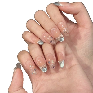 Handmade nude french press-on nails with pink bows and cat eye glitter details