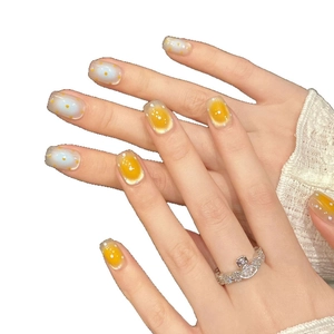 Handmade short square round press-on nails with yellow polka dots and cat eye finish
