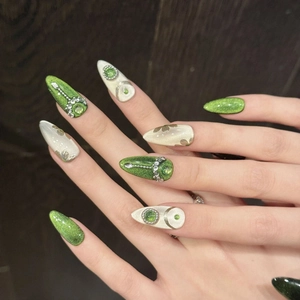 Luxury handmade almond press-on nails with green cat-eye finish and 3D rhinestone accents