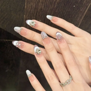 Purple cat eye press-on nails with 3D snowflakes, French tips and glitter accents