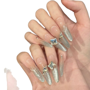 Sparkling silver cat-eye press-on nails with luxury rhinestones and pearl accents