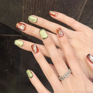 Vintage amber and emerald green cat eye press-on nails with gold foil and marble design