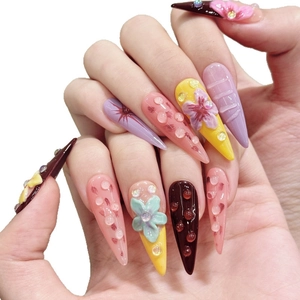 3D handmade stiletto nails with colorful dopamine floral accents and rhinestones