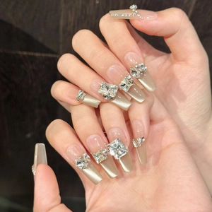 Handmade champagne cat-eye press-on nails with luxury K9 crystals in long trapezoid shape