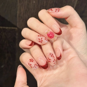 Hand-painted watercolor rose press-on nails with red French tips and silver glitter