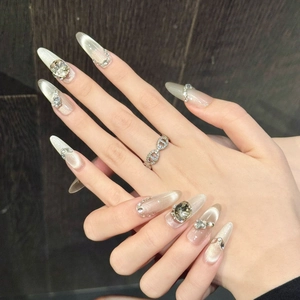 Champagne cat-eye press-on nails with luxury rhinestones on almond-shaped long tips