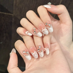 French style press-on nails with marble design, 3D bows and heart crystal rhinestones