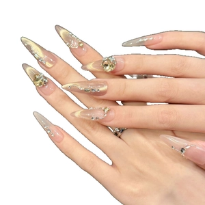 Champagne cat eye press-on nails in long stiletto shape with rhinestones and pearls