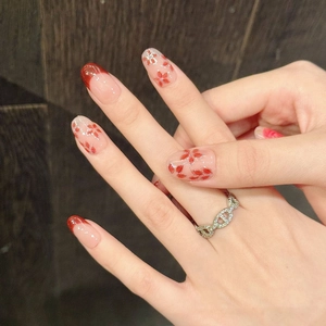 Hand-painted watercolor rose press-on nails with red French tips and floral design
