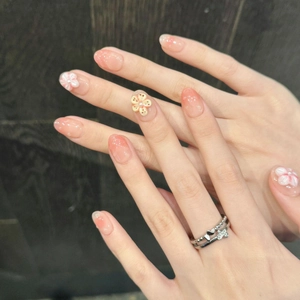 Pink gradient press-on nails with 3D frangipani flowers and pearl accents for beach vacation