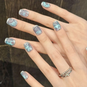 Short square blue purple cat eye press on nails with nebula dye and silver glitter detail