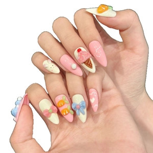 Hand-painted 3D press-on nails with cute bunny, ice cream, and bow designs in pink