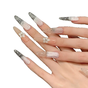 Pink cat eye press-on nails with 3D white flower accents and sparkling silver gradient