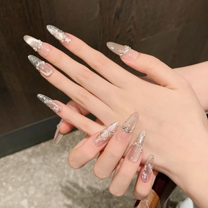 Pink cat eye almond press-on nails with glitter gradient and 3D floral pearl accents