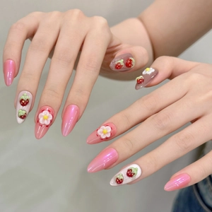 Handmade almond press-on nails with 3D strawberry and floral designs in pink and grey