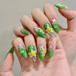 Handmade almond press-on nails with green cat eye gel, 3D floral relief, and water drops