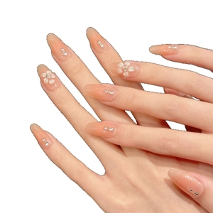 Handmade gradient nude press-on nails with 3D white floral, pearl and rhinestone accents