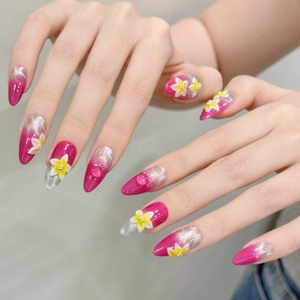 Faux ongles œil de chat rose avec fleurs 3D blanches et accents de gouttes d'eau