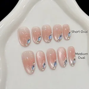 Faux Ongles à Presser Œil de Chat Faits à la Main Avec Strass Brillants Rose Nude Ovales pour Décoration d'Ongles Femme