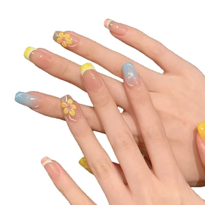 Pastel macaron press-on nails with 3D floral accents and blue-pink gradient finish