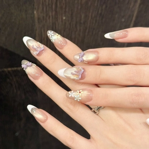 Taro cat eye press-on nails with 3D bows, pearls, and floral designs on almond shape