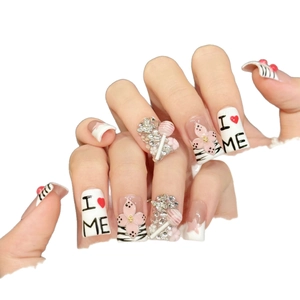 Pink cherry almond press-on nails with 3D lollipops and zebra patterns on white background