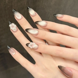 Handmade black gradient cat-eye press-on nails with 3D floral carving and almond shape