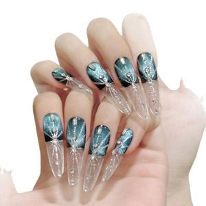 Dark blue cat eye stiletto press-on nails with silver glitter and rhinestones