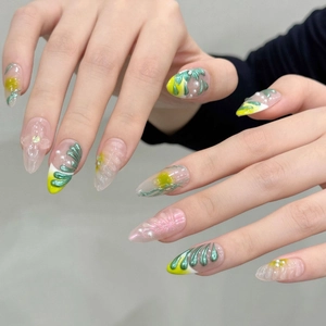 Handmade almond press-on nails with 3D floral designs, pearls and green yellow tones