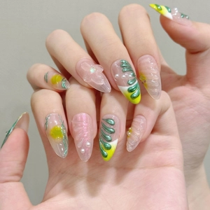 Nature-inspired stiletto press-on nails with 3D floral accents and pink cat-eye finish