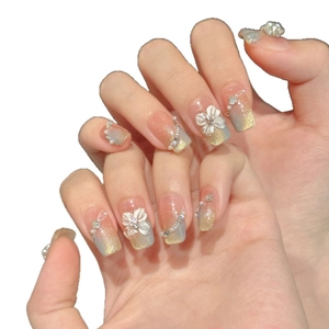 Handmade press-on nails with blue gradient, 3D white flowers, pearls and gold glitter