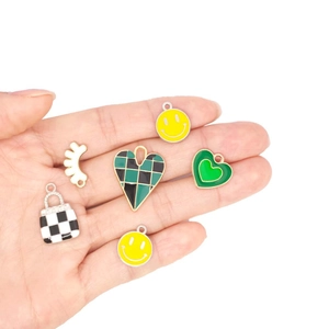 Set of 6 mixed DIY jewelry pendants featuring checkered hearts and smiley face charms