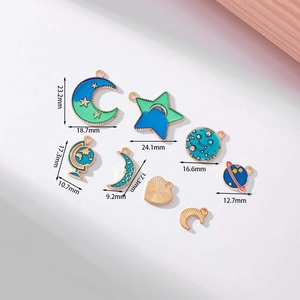 Blue celestial enamel pendants set with stars, moon, and earth, including size measurements