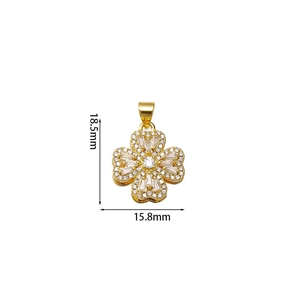 Detailed view of rotating gold clover pendant with zircon inlays and dimensions