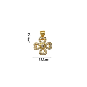 Macro shot of gold clover pendant with cubic zirconia inlay showing 15.5mm x 13.7mm dimensions
