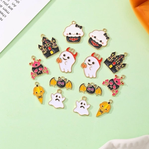 Detailed view of Halloween enamel charms with ghosts, bats, and castle for DIY jewelry