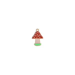 Macro detail of red mushroom enamel pendant with gold trim for DIY jewelry making