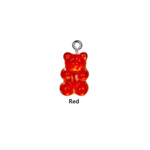 Macro detail of a red translucent gummy bear resin charm with a silver metal loop