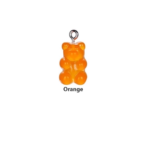 Detail view of orange gummy bear pendant with semi-transparent finish and metal loop