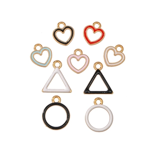 Detailed view of colorful alloy geometric pendants in heart and triangle shapes