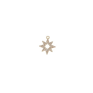 Macro detail of a gold-plated star pendant with inlaid white crystals and top loop