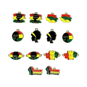 Detail of Pan-African enamel pendants with Black History Month and Juneteenth slogans
