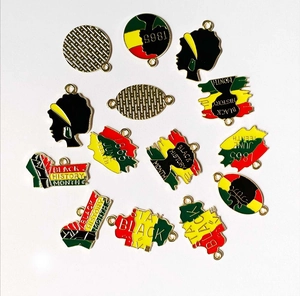 Macro detail of Juneteenth enamel charms with Pan-African colors for DIY jewelry making