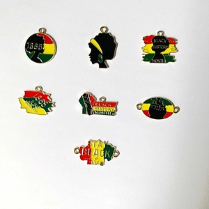 Detail view of 7-piece enamel Pan-African pendants for Black History Month DIY jewelry