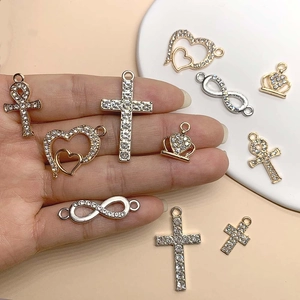 Assorted gold and silver DIY jewelry pendants with sparkling cubic zirconia settings